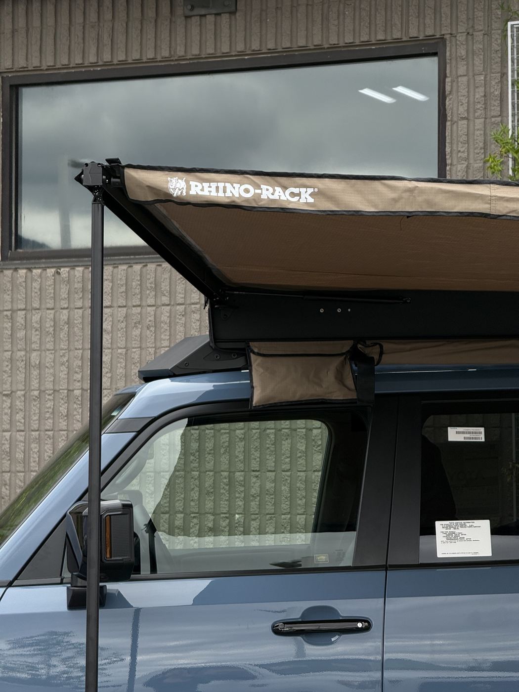 Close view of the Rhino-Rack awning on the Land Cruiser